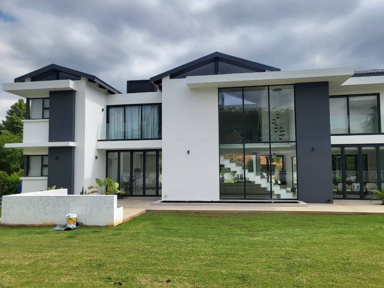 Contemporary double-storey home with white and charcoal exterior, The Islands