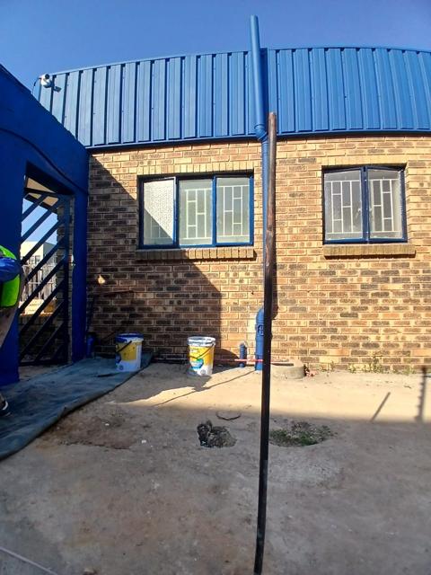 Industrial building with blue-coated steel cladding