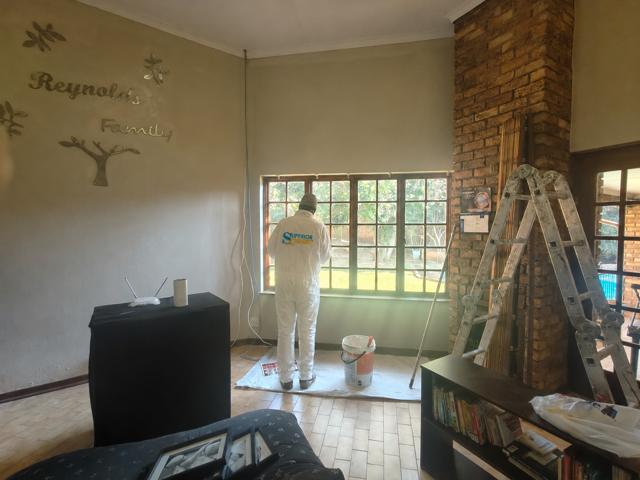 Painter working in a living room
