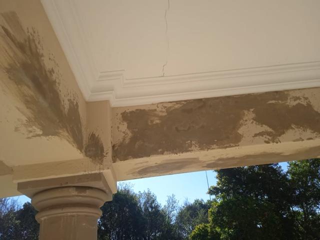 Patched plaster on a patio beam and soffit
